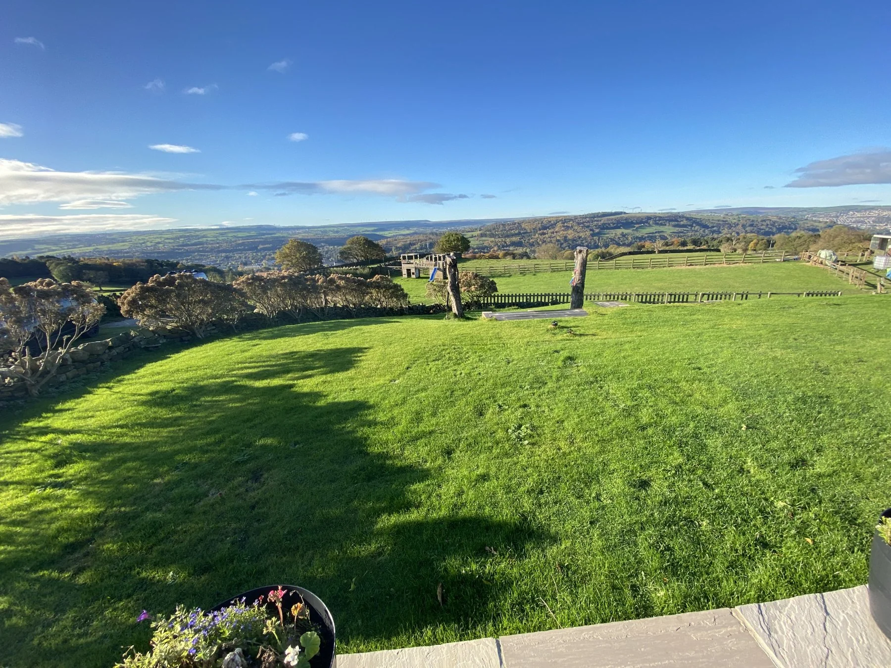 The open green space surrounding Higher Heights Farm